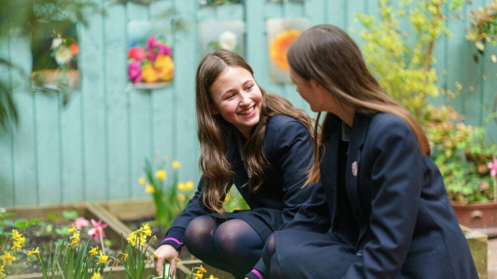 Girl smiling whilst gardening
